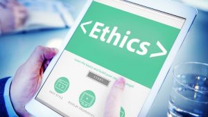 mobile tablet with the word ethics on it in medical setting