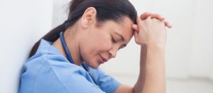 sad nurse experiencing burnout