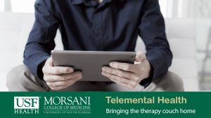 man on a couch with mobile table getting telemental health counciling