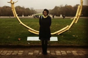 a usf health informatics program graduate in front of the Sydney and Walda Besthoff Sculpture