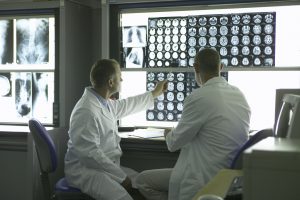 two doctors reviewing xrays