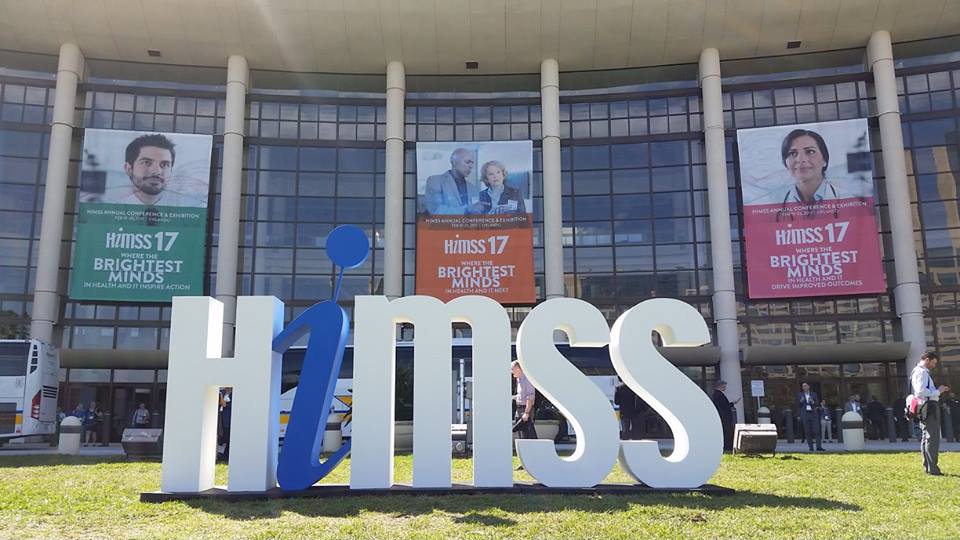 exterior of orlando convention center with himss logo in the foreground