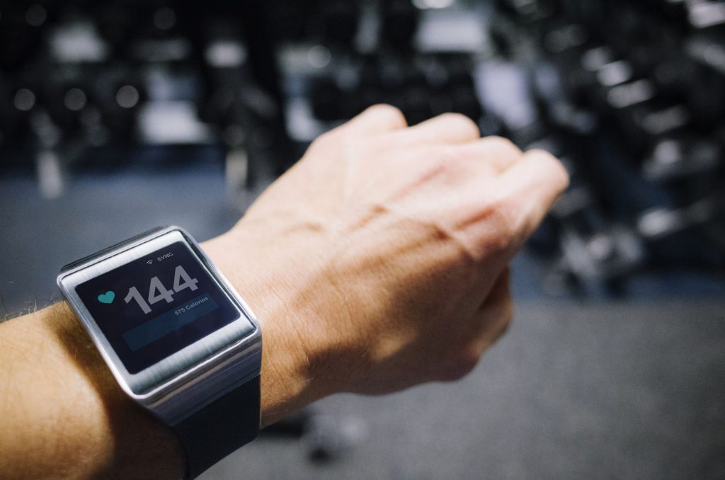 Looking down at a device showing a pulse reading.