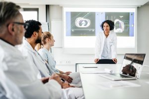 Clinicians discuss health data.